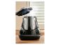 Robot de cuisine vapeur sur un comptoir, couvercle entrouvert.