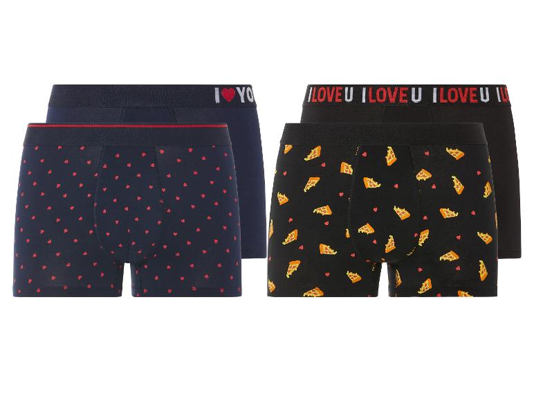 Deux paires de boxers, l'une avec un motif de cœurs et l'autre avec des pizzas.