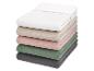 Pile de draps-housses en mousseline de coton de différentes couleurs