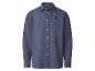 Chemise à manches longues bleu foncé avec boutons blancs et petit logo brodé sur la poitrine.