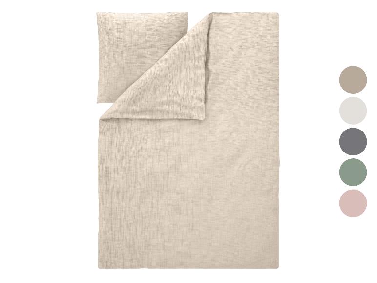 Parure de lit en lin beige (housse de couette et taie d'oreiller), avec options de couleurs à droite.
