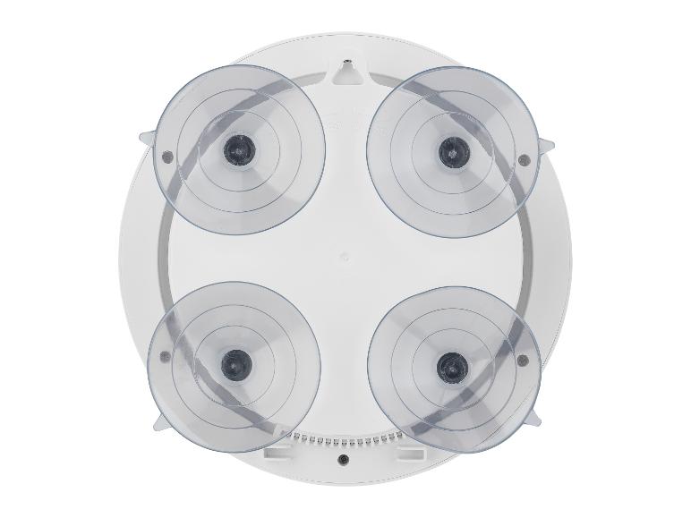 Un miroir rond à ventouses pour salle de bain.