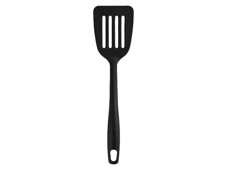 Une spatule noire avec un trou dans la poignée.