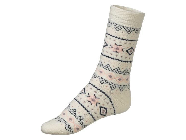 Une chaussette blanche avec un motif géométrique.