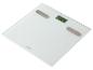 Pèse-personne blanc avec affichage numérique indiquant 62,4 kg