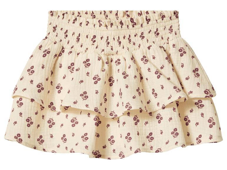 Jupe à volants crème avec imprimé floral bordeaux et taille smockée.