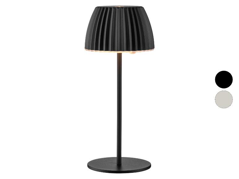Lampe de table noire avec abat-jour plissé et deux options de couleur.