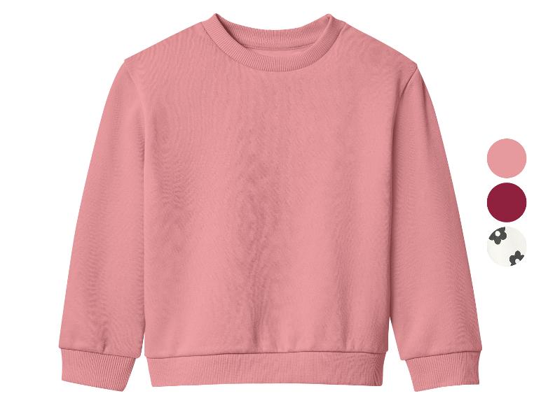 Un sweat-shirt rose à col rond avec des options de couleur à droite.