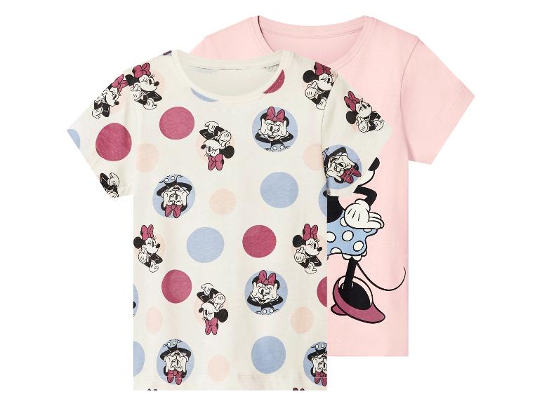 Deux t-shirts à manches courtes pour enfants: un blanc avec un motif Minnie Mouse et des pois, et un rose avec un grand imprimé Minnie Mouse.