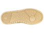 La semelle d'une basket beige à motif losange.