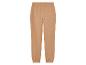 Pantalon de survêtement beige avec ceinture élastique.