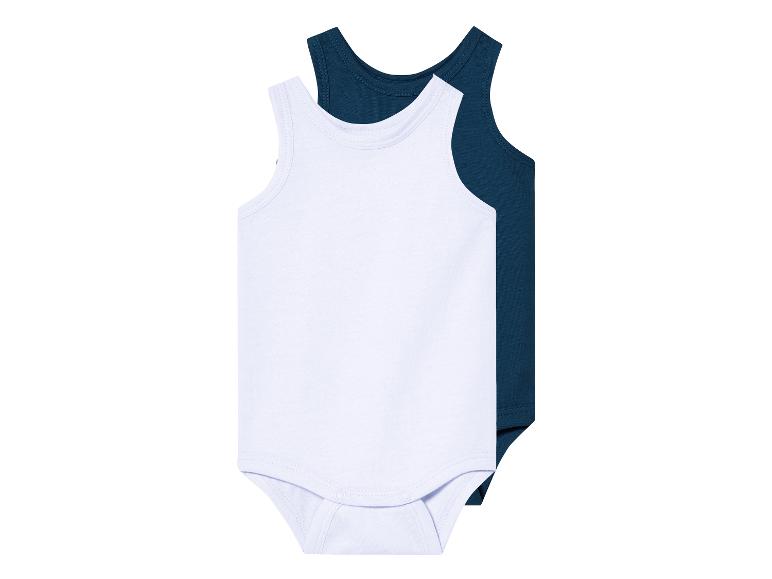 Deux bodys bébé, blanc et bleu marine.