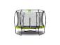 Trampoline rond avec filet de sécurité et rembourrage de protection vert.