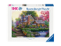 Puzzle de 1000 pièces représentant un chalet chaleureux dans un jardin fleuri au bord d'un étang