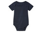 Un body bébé bleu marine à manches courtes.
