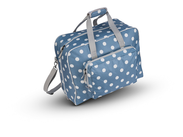 Un sac de voyage bleu à pois blancs.
