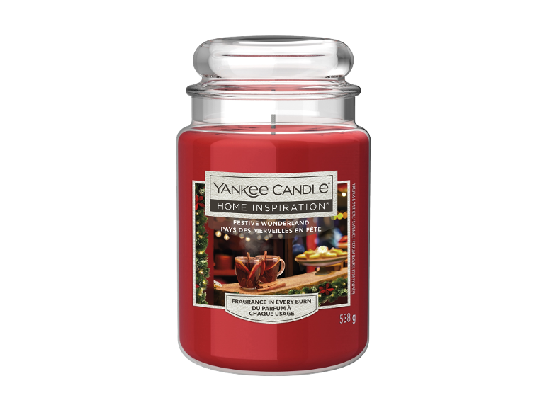 Bougie rouge en pot de verre avec étiquette thème festif et poids de 538 g.