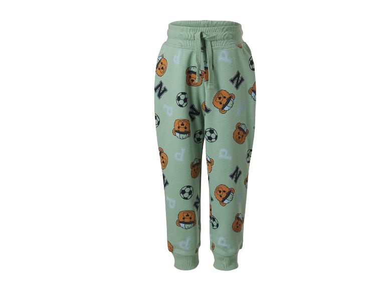 Pantalon de jogging vert avec motif têtes d'ours, ballons de football et lettres.