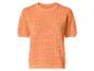 Haut femme orange à manches courtes en maille ajourée.