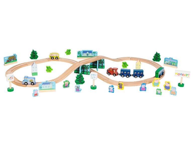 Ensemble de train en bois Peppa Pig avec rails, véhicules et figurines.