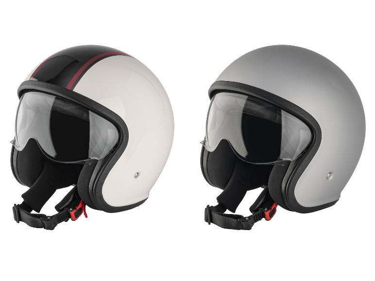 Deux casques de moto : un blanc avec des rayures noires et rouges, un gris