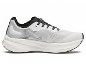 Chaussure de course blanche et noire avec semelle épaisse et lacets.