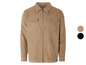 Une veste en velours côtelé beige avec fermeture éclair.
