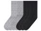 Six paires de chaussettes : trois noires et trois grises.