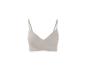 Soutien-gorge beige sans couture à bretelles réglables.