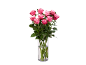 Bouquet de roses roses dans un vase en verre.