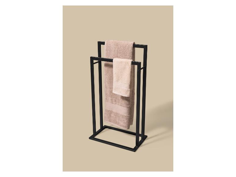 Porte-serviettes en métal noir avec deux serviettes beiges