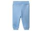 Pantalon de bébé bleu clair avec taille élastique et poignets côtelés.