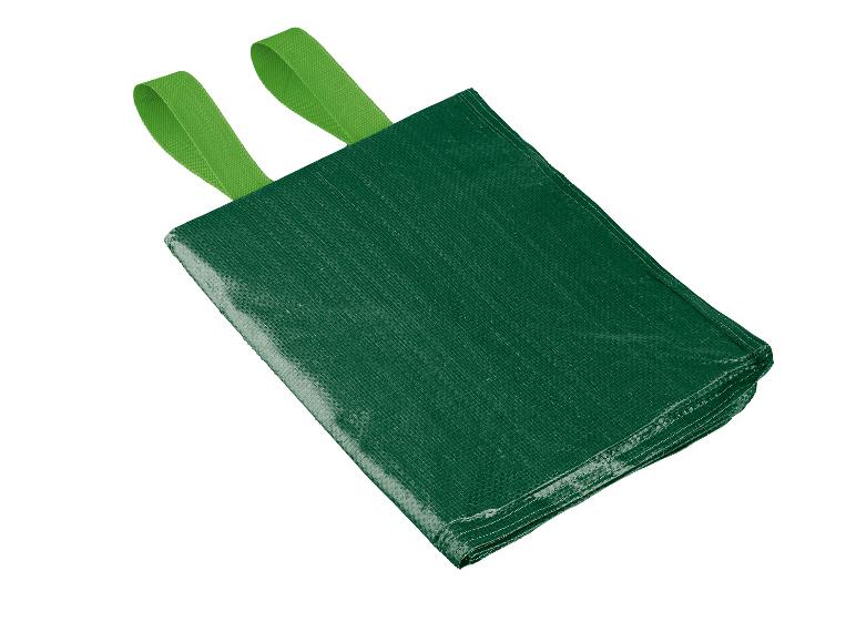 Un sac poubelle vert avec des poignées.