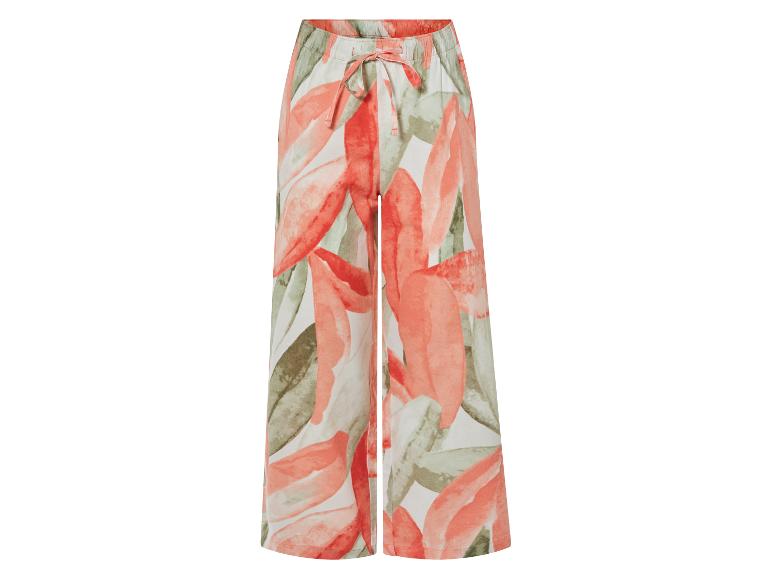 Pantalon large à motif floral, couleurs corail et vert.