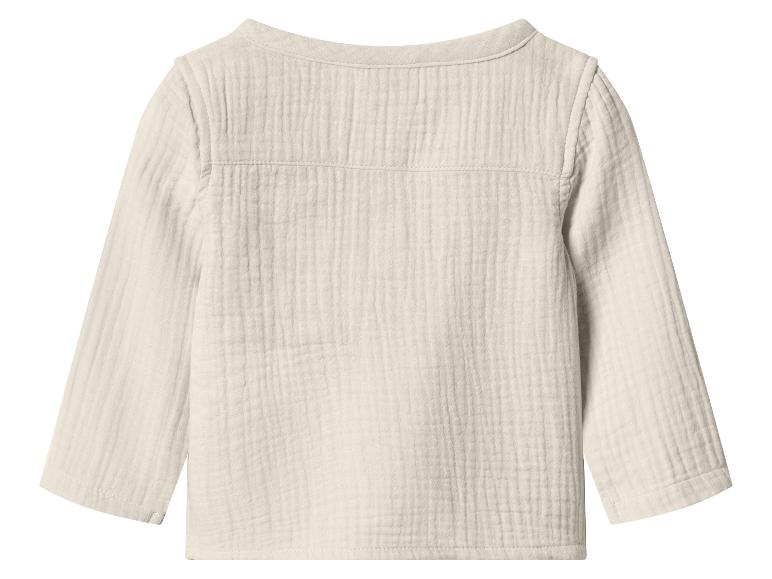 Dos d'un t-shirt enfant à manches longues beige clair avec une texture froissée.