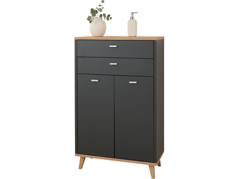 Meuble noir avec tiroirs et portes, avec plateau et pieds en bois, orné d'un vase et d'un distributeur de savon.