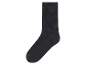 Une chaussette gris foncé, côtelée.