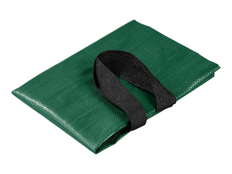 Sac de courses pliable vert avec poignées noires.