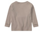 Chemise à manches longues beige avec une texture côtelée