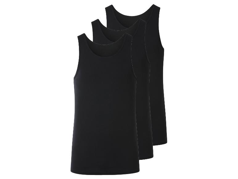 Trois débardeurs noirs pour hommes, empilés en diagonale.