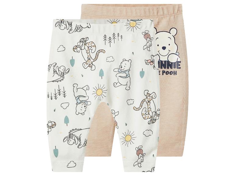 Lot de 2 pantalons bébé beiges et blancs avec imprimé Winnie l'Ourson.