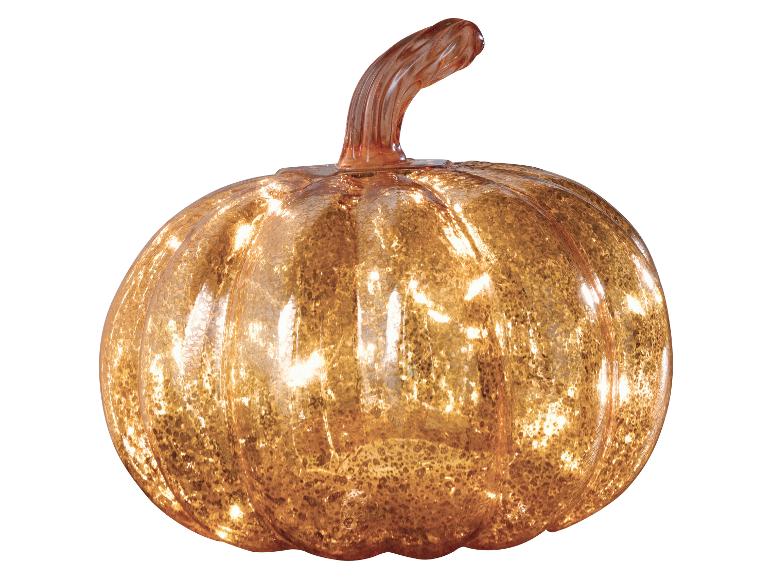Une citrouille décorative en verre avec une lueur chaude et illuminée, parfaite pour la décoration d'automne.