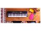 Clavier Yamaha PSR-E363 sur une table en bois avec des fournitures scolaires.