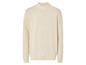 Un pull crème en tricot.