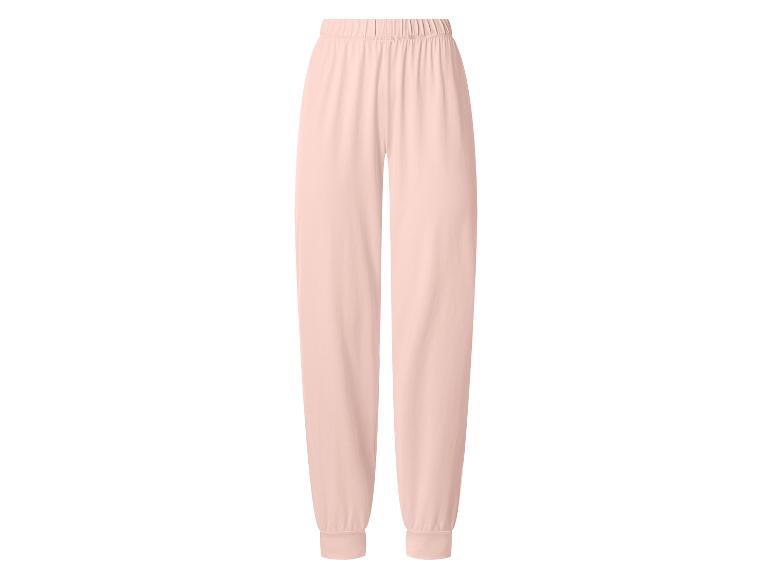 Pantalon de jogging femme rose clair avec taille élastique et chevilles resserrées.