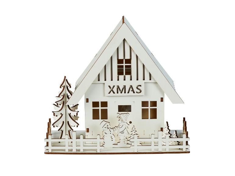 Maison décorative en bois sur le thème de Noël, avec l'inscription 'XMAS' et des figurines hivernales.