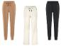 Trois pantalons de survêtement U.S. Grand Polo en marron, blanc et noir.