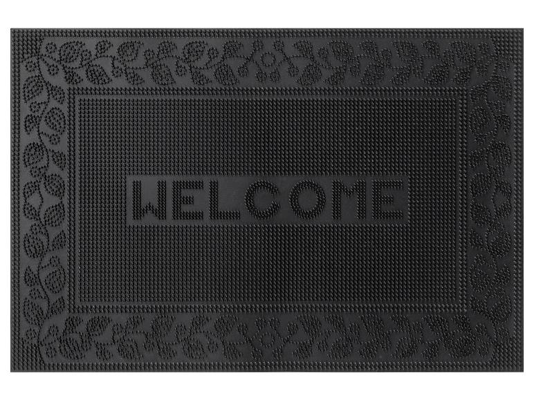 Un paillasson noir avec l'inscription 'WELCOME' et un motif de feuilles.