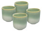 Quatre tasses vertes émaillées.