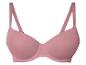 Soutien-gorge rose poudré, sans marques apparentes.